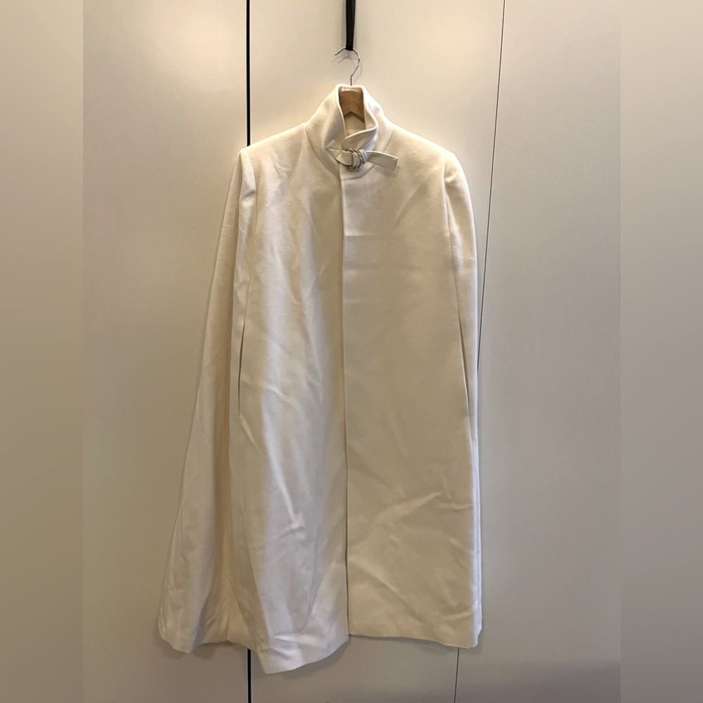 Custom made white wool poncho with lining and leather fastener detail